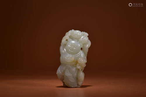 A JADE CARVING OF BOY