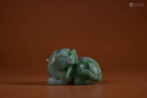 A MOTTLED JADEITE MYTHICAL BEAST PAPER WEIGHT