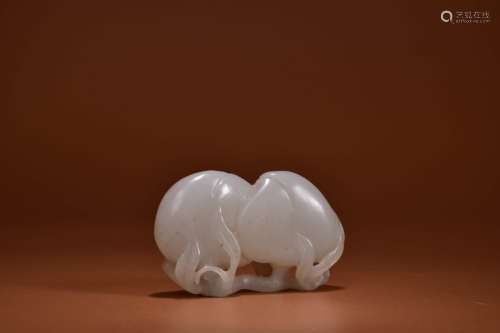 A WHITE JADE CARVING OF TWIN-PEACH