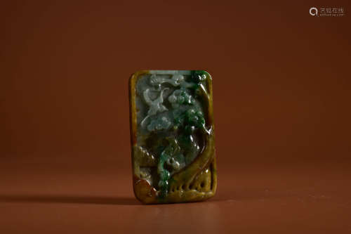 A MOTTLED JADEITE MAGPIE AND PRUNUS PLAQUE PENDANT