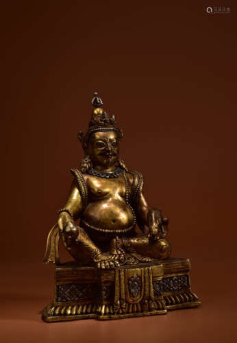 A GILT BRONZE STATUE OF YELLOW JAMBHALA