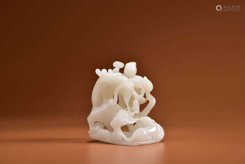 A HETIAN WHITE JADE CARVING OF DRAGON AND BOY