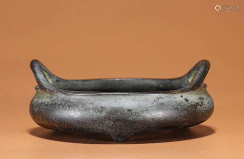 A BRONZE TRIPOD DOUBLE-EARED CENSER