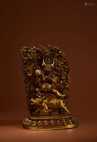 A GILT BRONZE FIGURE OF GUARDIAN