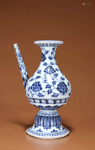 A BLUE AND WHITE FLOWER EWER