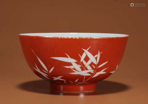 A CORAL RED GROUND REVERSE-DECO BAMBOO BOWL