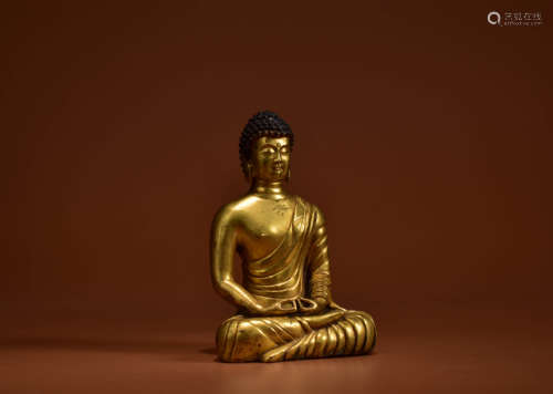 A GILT BRONZE STATUE OF SAKYAMUNI