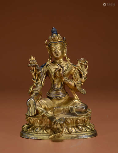 A GILT BRONZE STATUE OF GREEN TARA