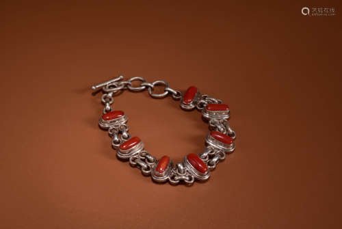 AN INLAID SILVER BRACELET