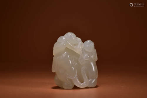 A WHITE JADE CARVING OF ELEPHANT AND BOY