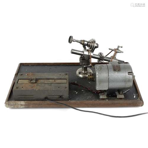 A lathe, together with a selection of watch tools and clocks...