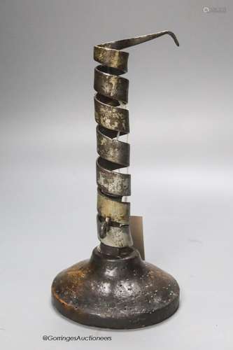 A late 17th century adjustable oak sheet-iron candlestick, h...