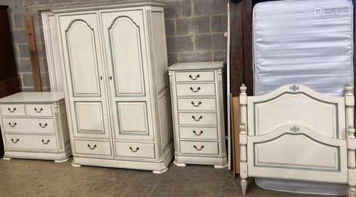 A French provincial style bedroom suite, cream painted, with...