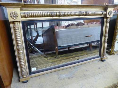 A Regency giltwood and gesso overmantel mirror, with ebonise...