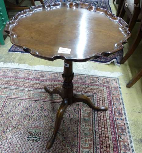 A George III and later mahogany tripod wine table, with piec...