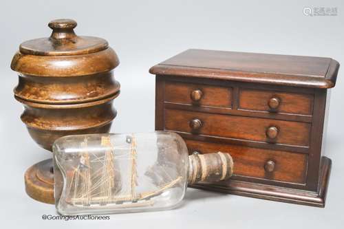 A Victorian mahogany 'chest of drawers' money bank, a turned...