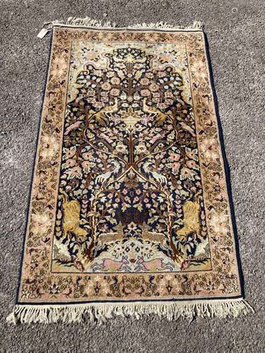 A 19th century Persian rug with Tree of Life field intersper...