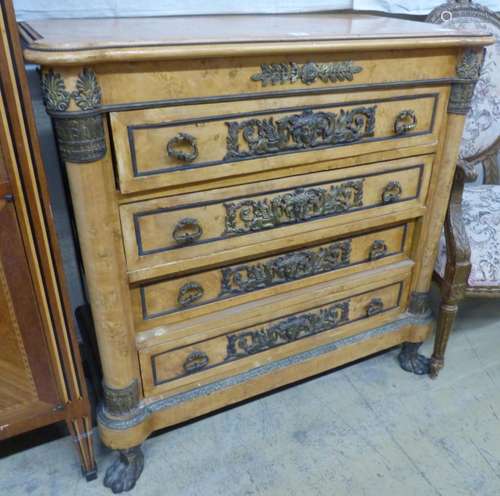 A French Empire style ormolu mounted walnut chest of drawers...