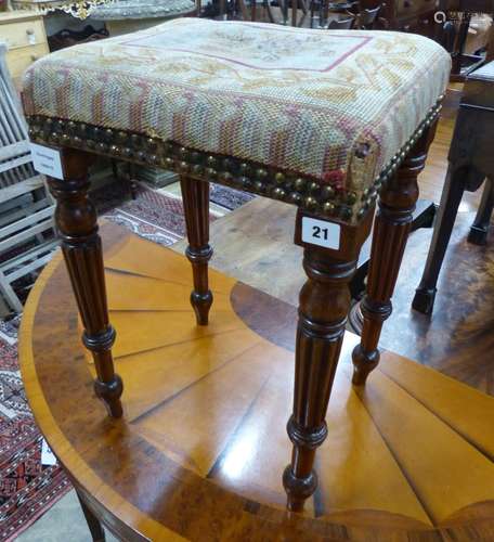 A small Regency mahogany upholstered stool, on fluted legs, ...