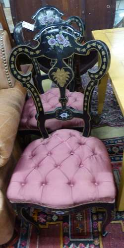 A pair of Victorian painted, ebonised side chairs.