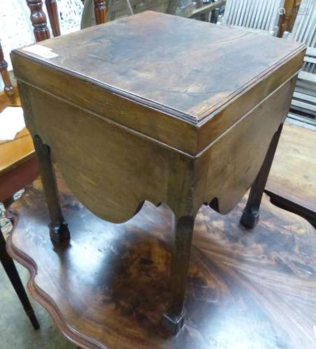 A George III mahogany commode, with shaped apron, on squared...