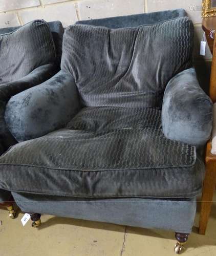 A George Smith armchair, re upholstered and on later feet.