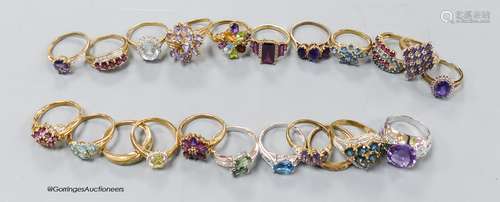 Twenty two assorted modern 9ct or 9k and gem set dress rings...