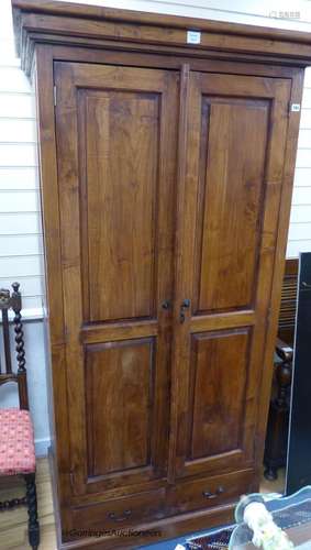 A hardwood two door cabinet, length 102cm, depth 68cm, heigh...