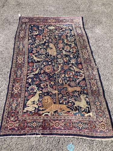 A Persian rug with a central Tree of Life interspersed with ...