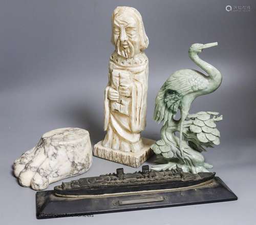 A large marble lion's paw, an alabaster monk, a soapstone cr...