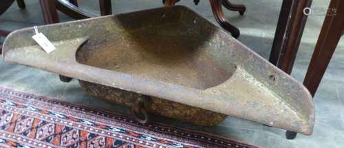 A cast iron corner feed trough, W.89cm D.46cm