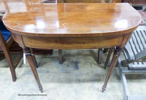 A Regency inlaid mahogany D shaped folding card table, width...