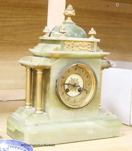 A French onyx and gilt metal mantel clock, with pendulum and...