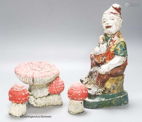 A composition seated garden gnome, height 29cm, and three to...