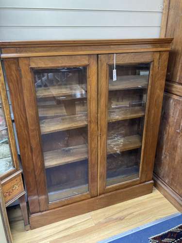 A late Victorian glazed walnut bookcase. W-112, D-28, H-138c...