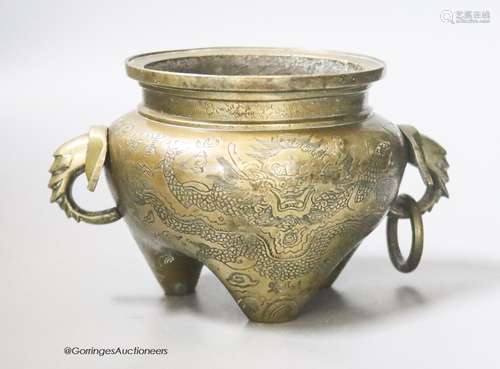 A Chinese bronze censer with dragon decoration, Qing period,...