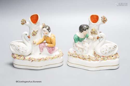 A pair of Victorian Staffordshire swan spill vases, height 1...