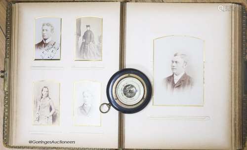 A Victorian monochrome photograph album and an aneroid barom...