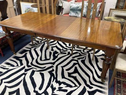 A Victorian style mahogany extending dining table. 214 exten...