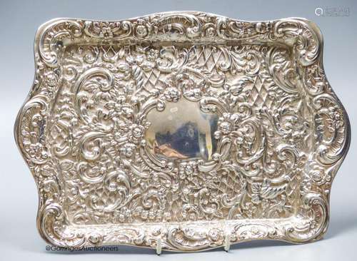 An Edwardian embossed silver rectangular dressing tray, Henr...