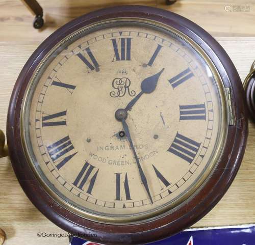 An early 20th century mahogany circular wall clock, with key...