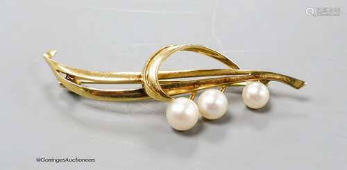 A yellow metal (stamped 14k) and three stone cultured pearl ...