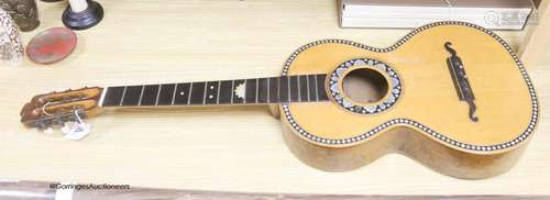 A Mexican mother of pearl inlaid acoustic guitar (no strings...