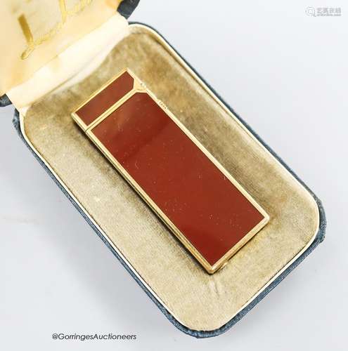 A boxed red Dunhill lighter and a silver plated tobacco cadd...