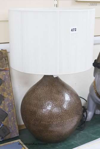 A contemporary hammered metal table lamp, overall height 57c...