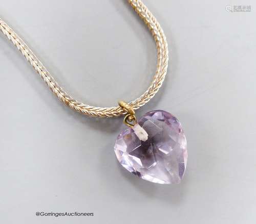 A heart shaped facet cut amethyst pendant, 15mm, on a modern...