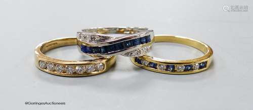 A modern 18ct gold and channel set sapphire and diamond half...