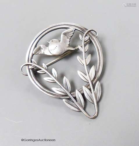 A Georg Jensen sterling circular framed 'bird amid foliage' ...