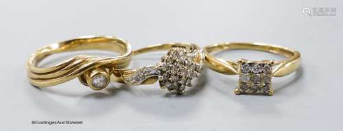 Three assorted modern diamond set dress rings, two stamped 9...