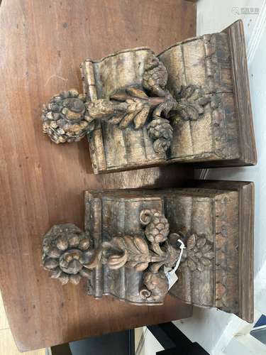 A pair of Indian teak wall brackets carved with lotus. W-25,...